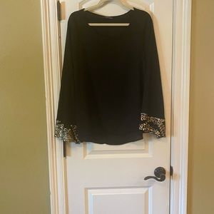 Caramela (boutique) black and gold sequin blouse with bell sleeves.